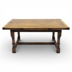 Titchmarsh & Goodwin - stained oak draw leaf dining table, raised on turned supports with H-stretcher, extends to 273cm