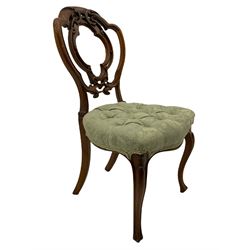 19th century walnut framed chair, shaped pierced back carved with foliage scrolls, the seat upholstered in buttoned floral pattern fabric, on carved cabriole supports