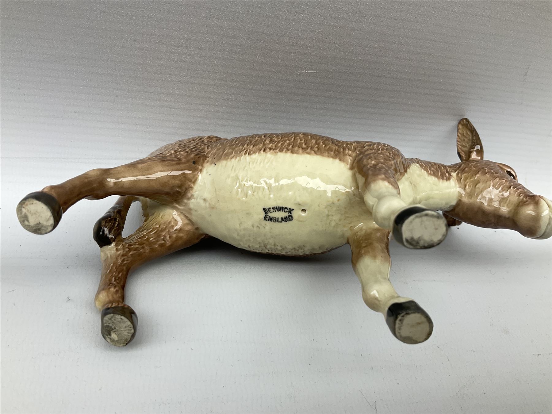 Beswick donkey family to include no.1364b, no.2267a, another donkey and donkey foal (4)