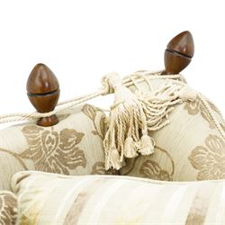 Traditional knoll sofa, upholstered in cream and olive floral fabric, adjustable drop ends secured by cords to turned finials, loose seat and back cushions with piped edges, on square tapering feet, with four scatter cushions