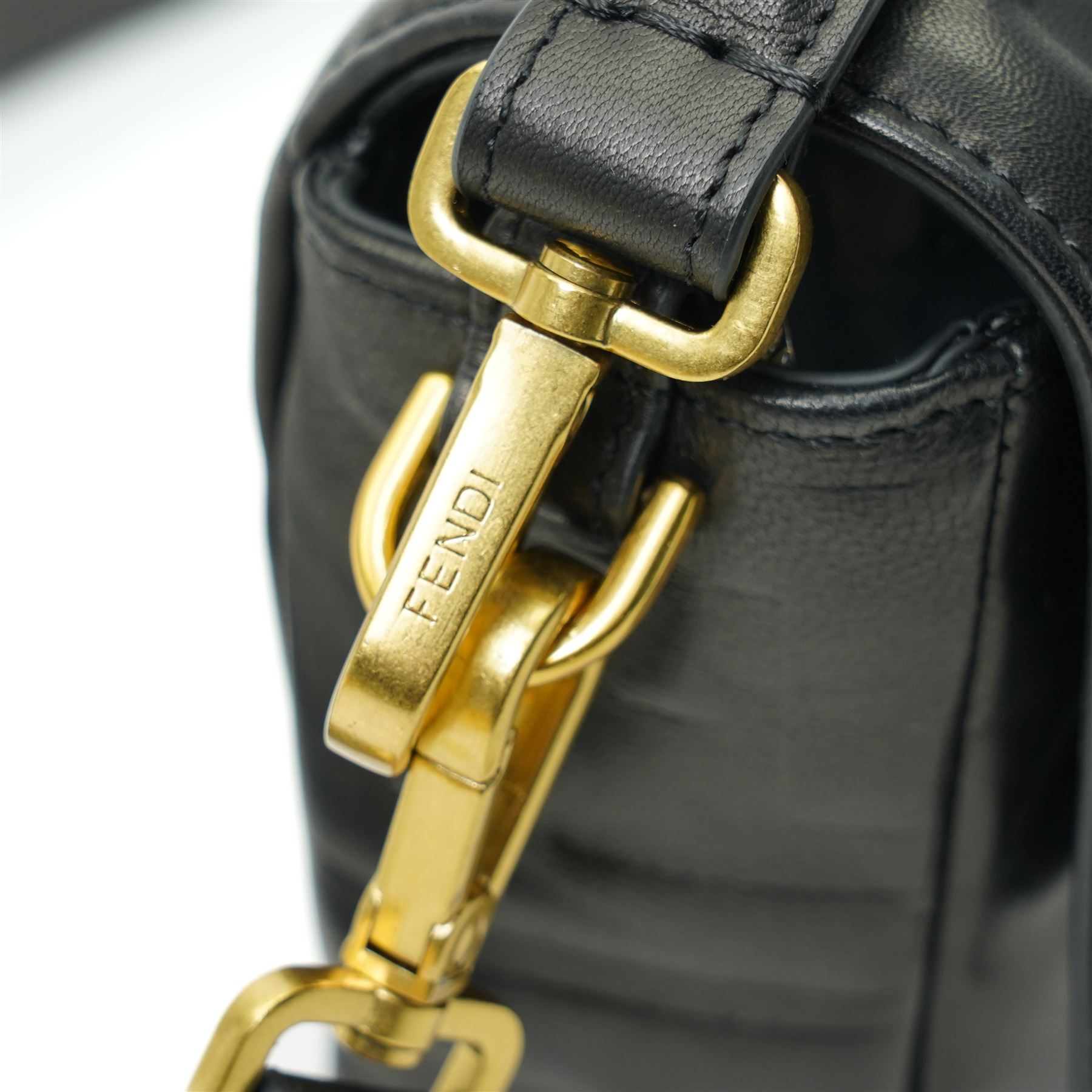 Fendi Baguette shoulder bag, black nappa leather with embossed FF monogram and quilted panels, the front flap secured by a gold-tone FF logo magnetic clasp engraved Fendi Made in Italy, with detachable leather shoulder strap and gold-tone hardware, interior leather tab stamped 'Baguette Fendi Made in Italy', together with original Fendi dust bag and box, W27cm D7cm H15cm