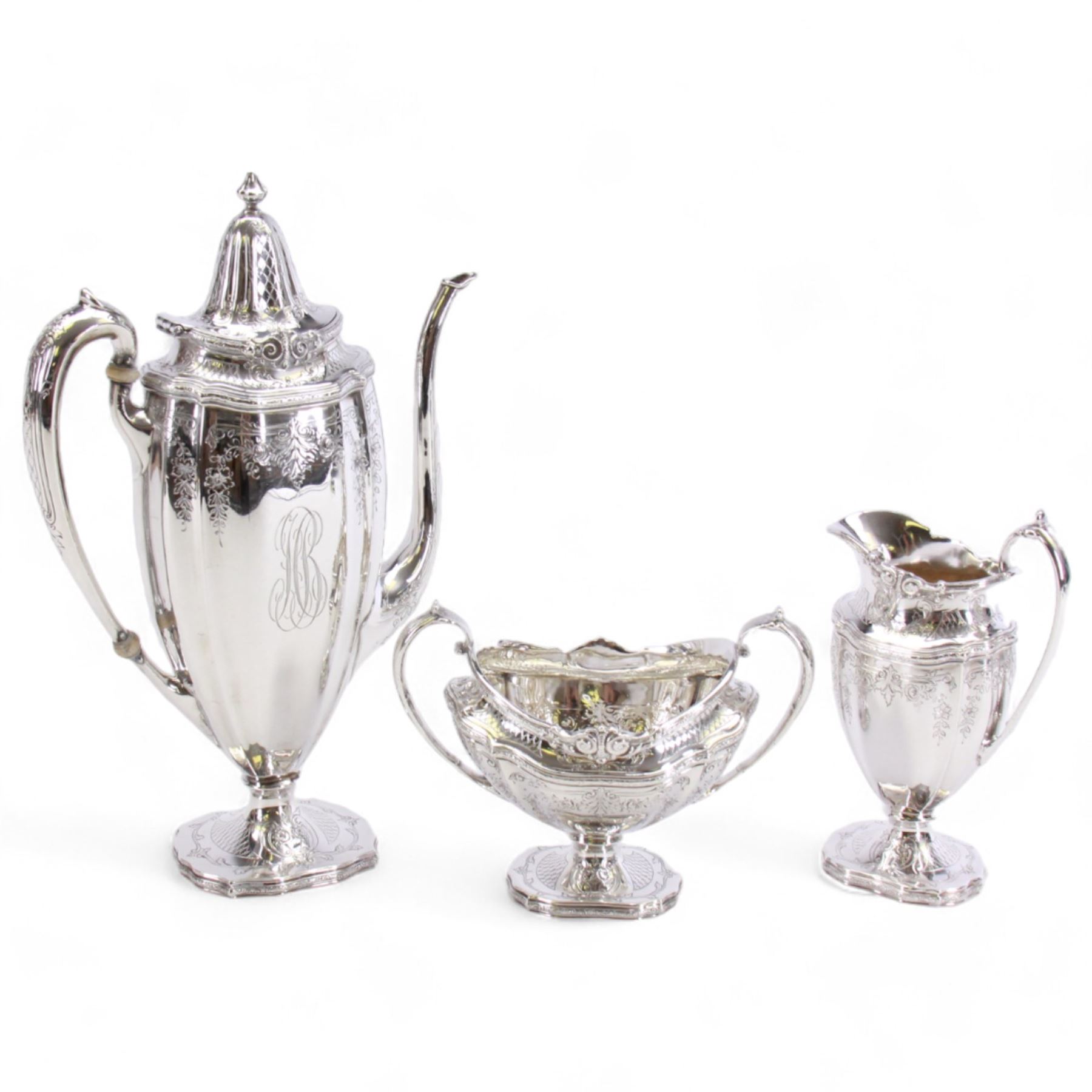 Early 20th century American silver three piece coffee service, comprising coffee pot with ivory insulators to the handle, twin handled sucrier, and cream jug, each of part reeded form chased with foliate swags and bands, each marked for Black, Starr & Frost, New York, also stamped Sterling, Chippendale Exclusive Design, coffee pot H27cm, including handles sucrier H12, including handle cream jug H15.5cm

This item has been registered for sale under Section 10 of the APHA Ivory Act
