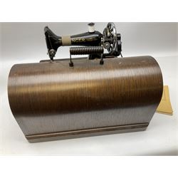 Singer sewing machine no. EA584046 in case (missing key) and Singer Manual of Family Sewing Machines