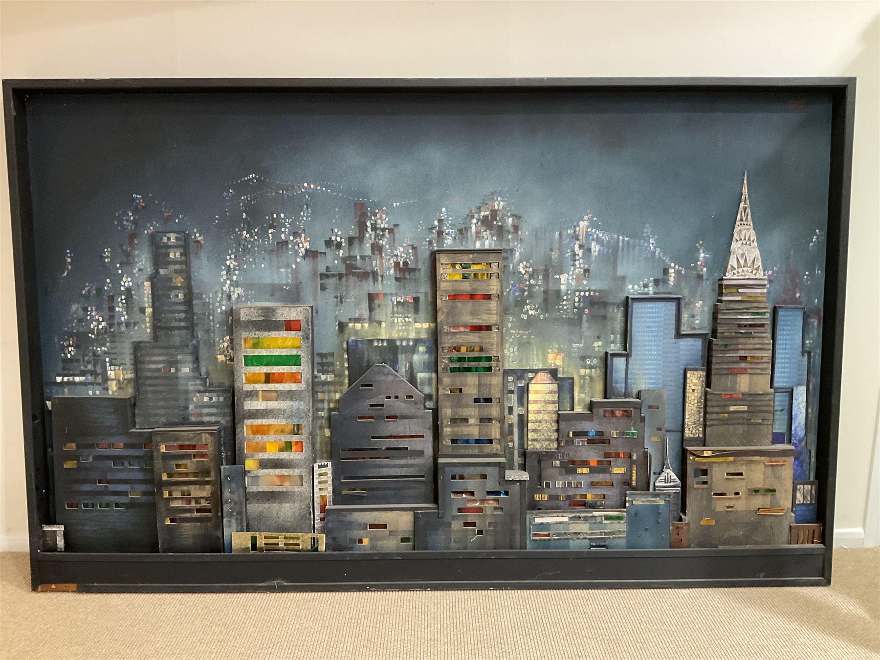 Dennis Clegg (Scottish 1929-): 'New York Skyline', illuminated oil on 3-D wooden construction with perspex and paper signed and dated 1963/2000 (the latter date refers to when the artist restored it) 155cm x 250cm overall
Provenance: commissioned by Lanarkshire entrepreneur John Kane in 1963 from the artist who had graduated at Manchester School of Art in 1960 and went on to work as an interior designer for the next 35 years painting in his spare time.