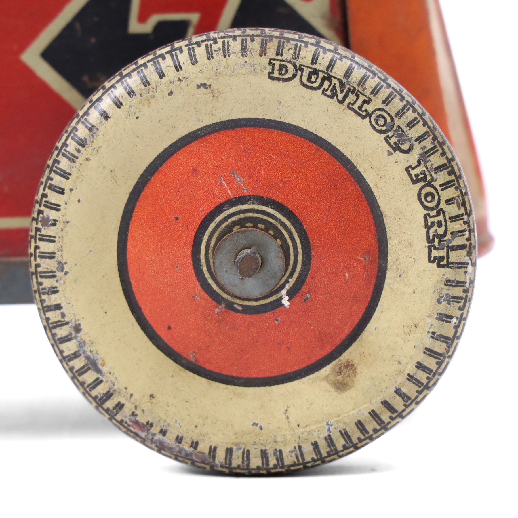 Mettoy tinplate clockwork racing car, the boat tailed red body with lithographed details, racing no. 7, with Dunlop Fort tyres, driver and key, H8cm, L32cm
