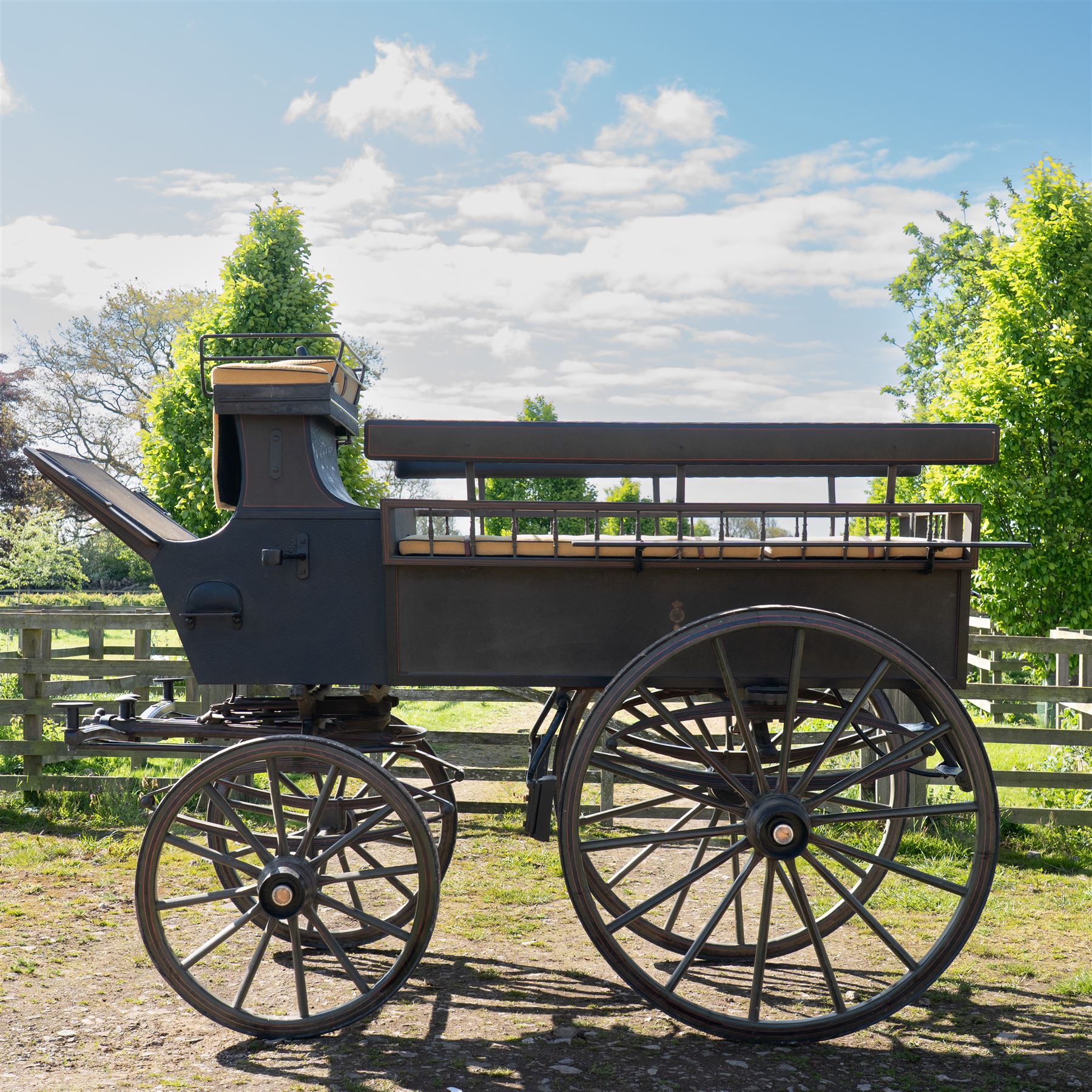 The Zetland Body Break by Peters & Sons, London

A fine and substantial late nineteenth century body break by Peters & Sons of London, circa 1880, formerly owned by the Marquis of Zetland. The carriage is finished in dark olive green and black with red, black and yellow lining, and is fitted with an elevated coachman’s box seat above a forward luggage compartment. The open rear body is entered by side doors and arranged with opposing longitudinal passenger seating.

The carriage is mounted on English pattern wooden artillery wheels with iron tyres and is carried on full elliptic springs, with a transverse helper spring behind. The front axle is fitted with fifth wheel turntable steering. The rear passenger compartment has upholstered longitudinal side benches beneath padded back rails, with turned spindle upper panels to the side doors and rear handrails. The driver’s seat is upholstered in corded fabric and secured with leather retaining straps.

Details include shaped splinter bar and turntable, folding rear step below the door with leather covered interior handle, luggage rails to either side, pole fittings for use with a pair or team of horses, and a handbrake with brake blocks operating to both rear wheels. The wheel hubs are fitted with polished hub caps engraved “Peters & Sons, London”. The exterior retains small Zetland family crests to the side panels.

The carriage has been conserved by Woods of Fairbourne Carriages Ltd and is recorded as Lot 146 in The George Shaw Collection sale, 5 November 2003, where it was catalogued as The Zetland Body Break and described as having previously been owned by the Marquis of Zetland.

Features
• Peters & Sons, London coachbuilder’s hub caps
• Known as The Zetland Body Break
• Formerly owned by the Marquis of Zetland
• Circa 1880
• Conserved by Woods of Fairbourne Carriages
• Dark olive green and black bodywork with red, black and yellow lining
• Elevated coachman’s box seat
• Forward luggage compartment
• Open rear passenger body with side doors
• Opposing longitudinal passenger seating
• Turned spindle upper panels to the side doors
• Folding rear step with leather covered interior handle
• Full elliptic spring suspension with transverse helper spring behind
• Fifth wheel turntable steering
• Handbrake with brake blocks operating to both rear wheels
• Wooden artillery pattern wheels with iron tyres
• Shaped splinter bar and pole fittings for a pair or team of horses
• Small Zetland family crests to the side panels

Provenance
The George Shaw Collection, 5 November 2003, Lot 146. Previously owned by the Marquis of Zetland.

Conservation

Conserved by Woods of Fairbourne Carriages.

Dimensions:
Overall length: 310 cm
Width: 176 cm
Height: 226 cm

Front wheel diameter: 98 cm
Rear wheel diameter: 140 cm

Seating:
Driver's box seat: 2 persons

Rear passenger compartment: Two longitudinal benches accommodating approximately 8 to 10 passengers