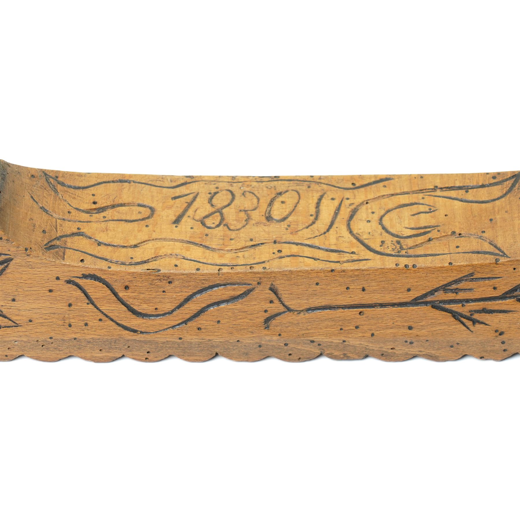 19th century treen mangle board, incised date 1830, decorated with various foliage, W70cm 