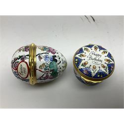 Halcyon Days bonbonniere, modelled as pink roses in a planter painted with a blue and white Japanese scene, together with five Halcyon Days enamel boxes, one a larger example depicting 'The Becket Casket' and four smaller boxes, including The 1993 Easter Egg, Happy Birthday and Statue of Liberty examples, all boxed, Becket Casket D8cm
