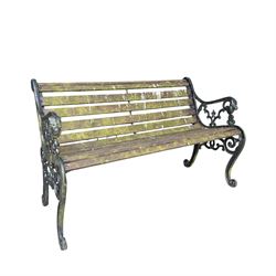Pair of Victorian Revival Coalbrookdale design 'Dog and Serpent' pattern benches with slatted seats, the cast iron end supports of pierced and scrolling design with dog mask arm terminals