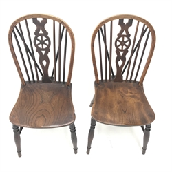  Six 19th century Thames Valley elm wheel back Windsor chairs, shaped seat on turned supports joined by stretchers, two stamped TB one stamped IH (6)  