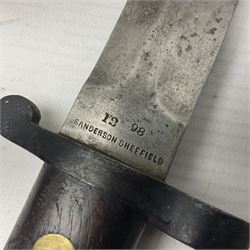 British Pattern 1888 knife bayonet, the 30cm double edged blade by Sanderson with central raised medial ridge and various marks to the ricasso including date code 12 98; in leather covered scabbard with various stamped marks L44cm overall