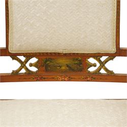 Pair of Victorian Sheraton Revival painted satinwood armchairs, the cresting rail painted with trailing floral bouquets flanked by illusion arcade motifs, over a cameo back and sides with acanthus painted swell-turned uprights, the lower back rail decorated with a bird scene and flanking pierced foliate design, upholstered in ivory fabric, raised on turned supports with further acanthus leaf paintwork, terminating to brass castors