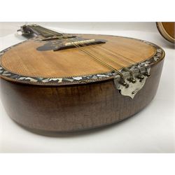 Italian eight-string mandolin with maple back and ribs and spruce top with inlaid floral marquetry panel within a fragmented mother-of-pearl border L61cm; cased; and a (damaged) German 'Michigan' mandolin for spares or repair (2)