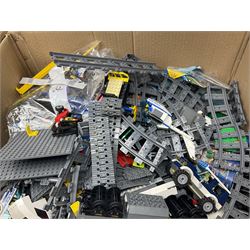 Very large collection of Lego, predominantly loose but some part constructed models, including Lego City, Lego Technic, Chima, Arctic 5, train set, mobile crane etc; together with numerous instruction booklets and some empty boxes; contained in two large cardboard boxes with gross weight of over 24kgs
