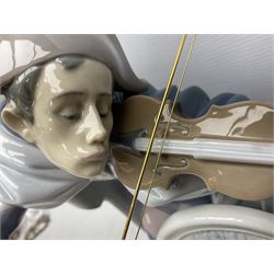 Lladro figure, Jester Serenade, modelled as a ballerina with bouquet of flowers seated before a jester playing the violin, limited edition 2541/3000, sculpted by Antonio Ramos, no 5932, with original box, year issued 1993, year retired 1994, H37cm
