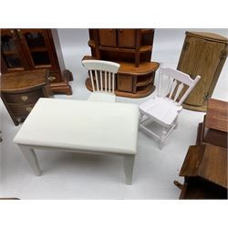 Doll's house wooden furniture - over twenty items including good quality pine Welsh dresser by Tony of Lincoln; tall 'glazed' bookcase; two-tier side cabinet; grand piano; bedside chest, mule chest, Canterbury; cradle; Georgian style hanging corner cupboard; dumb waiter; tables; chairs; rocking chair etc; various scales