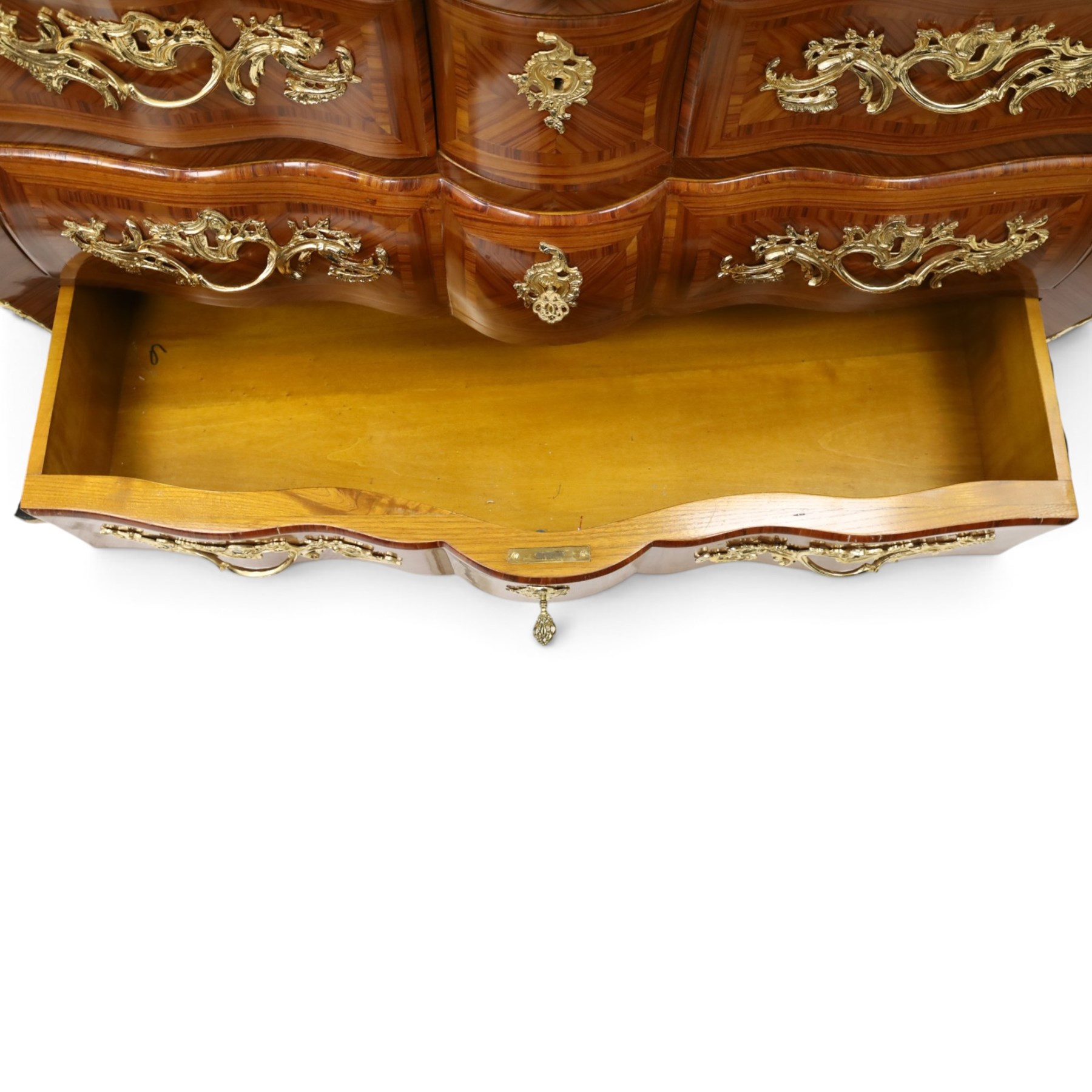 Colombo Mobili - Italian Louis XV design kingwood and marquetry bombé commode chest, the shaped marble top with moulded edge, fitted with an assortment of three shaped short drawers over two long, each with parquetry veneered facias and rocaille shaped gilt metal handles and escutcheons, flanked by gilt metal cartouche mounts with scroll and foliate detail, shaped apron on splayed bracket feet