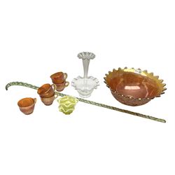 Amber carnival glass punch bowl and five cups with lustre finish, glass epergne with frilled rim and tall central trumpet, two lemon vaseline twin handled cups and a Victorian frigger cane, H87cm