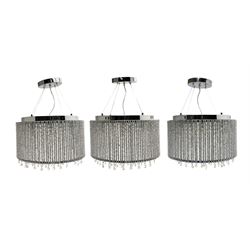 Set of three circular ceiling lights, with hanging faceted drops with chrome fittings, retailed by John Lewis D42cm