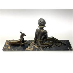 An Art Deco spelter figure group, modelled as a seated female figure and deer, upon black marble base, L57.5cm H25cm. 