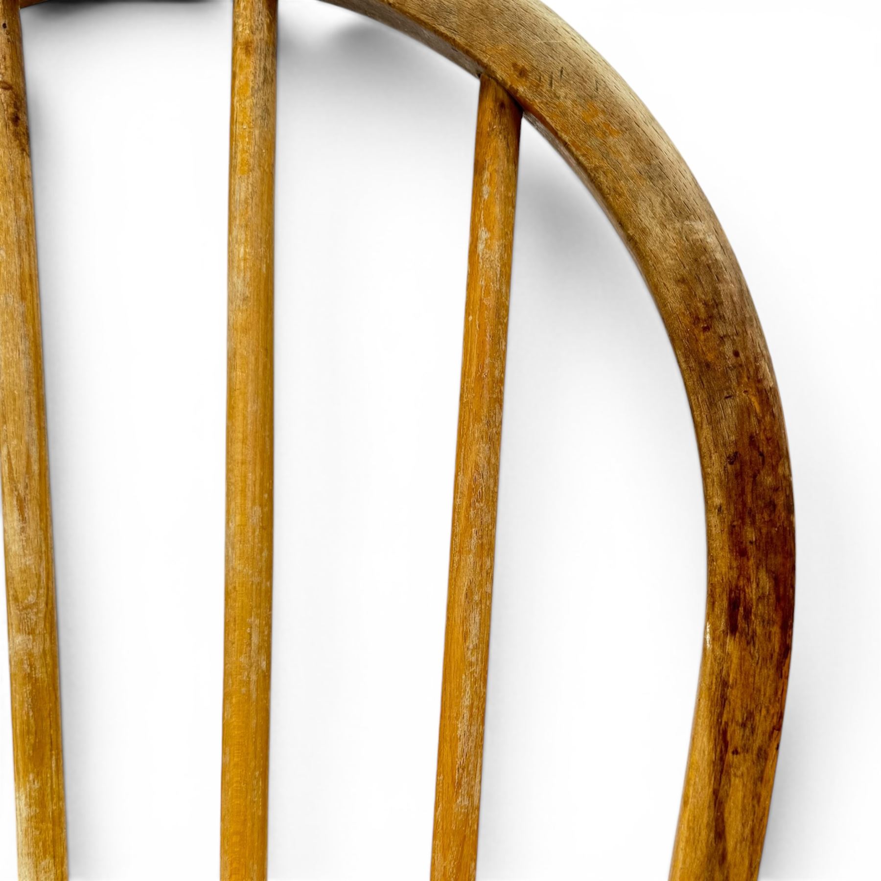 Ercol - set of four elm 'Windsor' chairs, hoop design back dish seat, tapering supports united by H-stretcher 