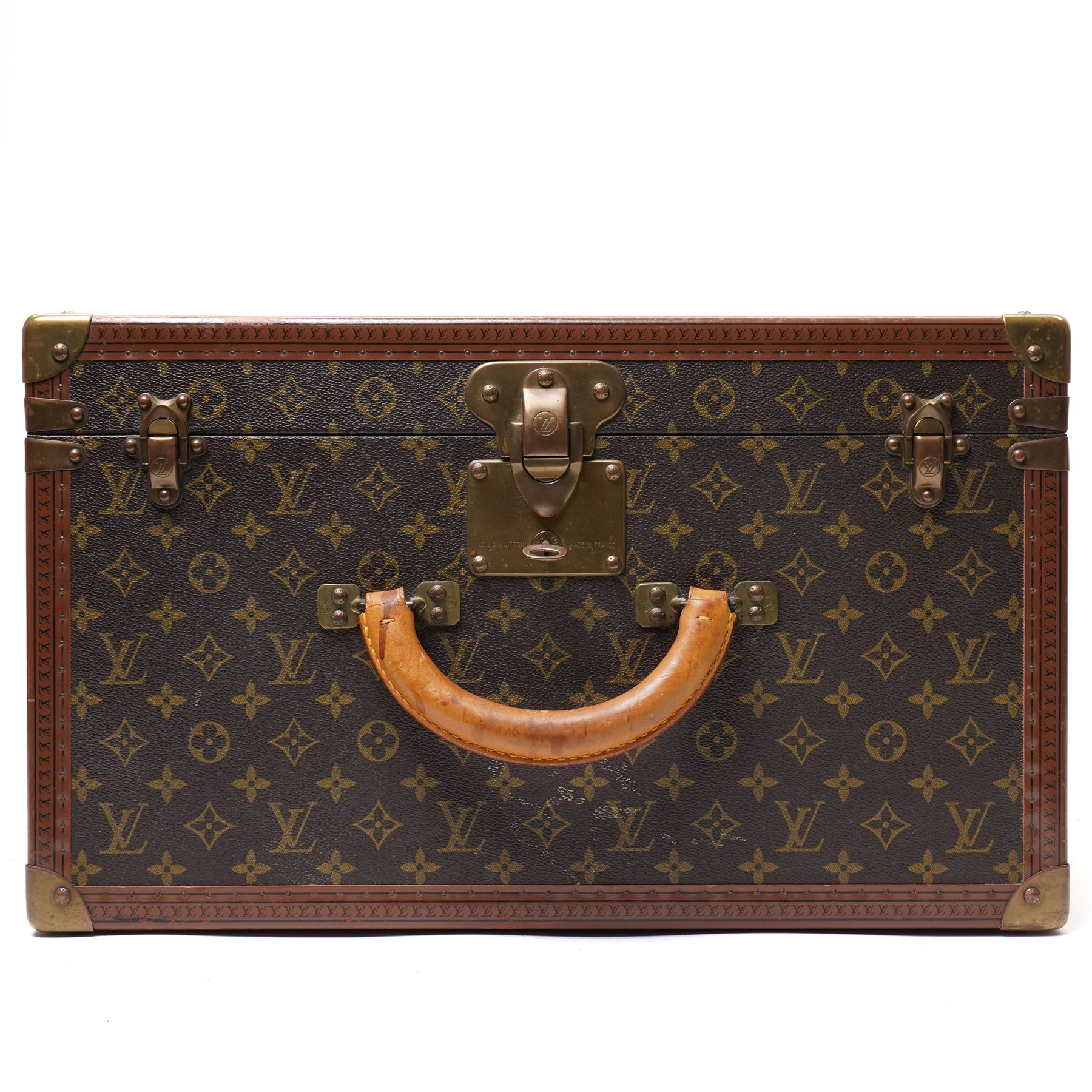 Mid-20th century Louis Vuitton monogram cabin trunk,  monogram canvas with lozine trim and brass mounts, single front leather handle with lock stamped Louis Vuitton with key code 1080701, the interior fitted with original webbing straps and lift-out tray, label to lid printed 'Avenue Marceau 78bis - Paris Nice - 2 Avenue de Suède' serial number 953998, circa1960s, with original key present

