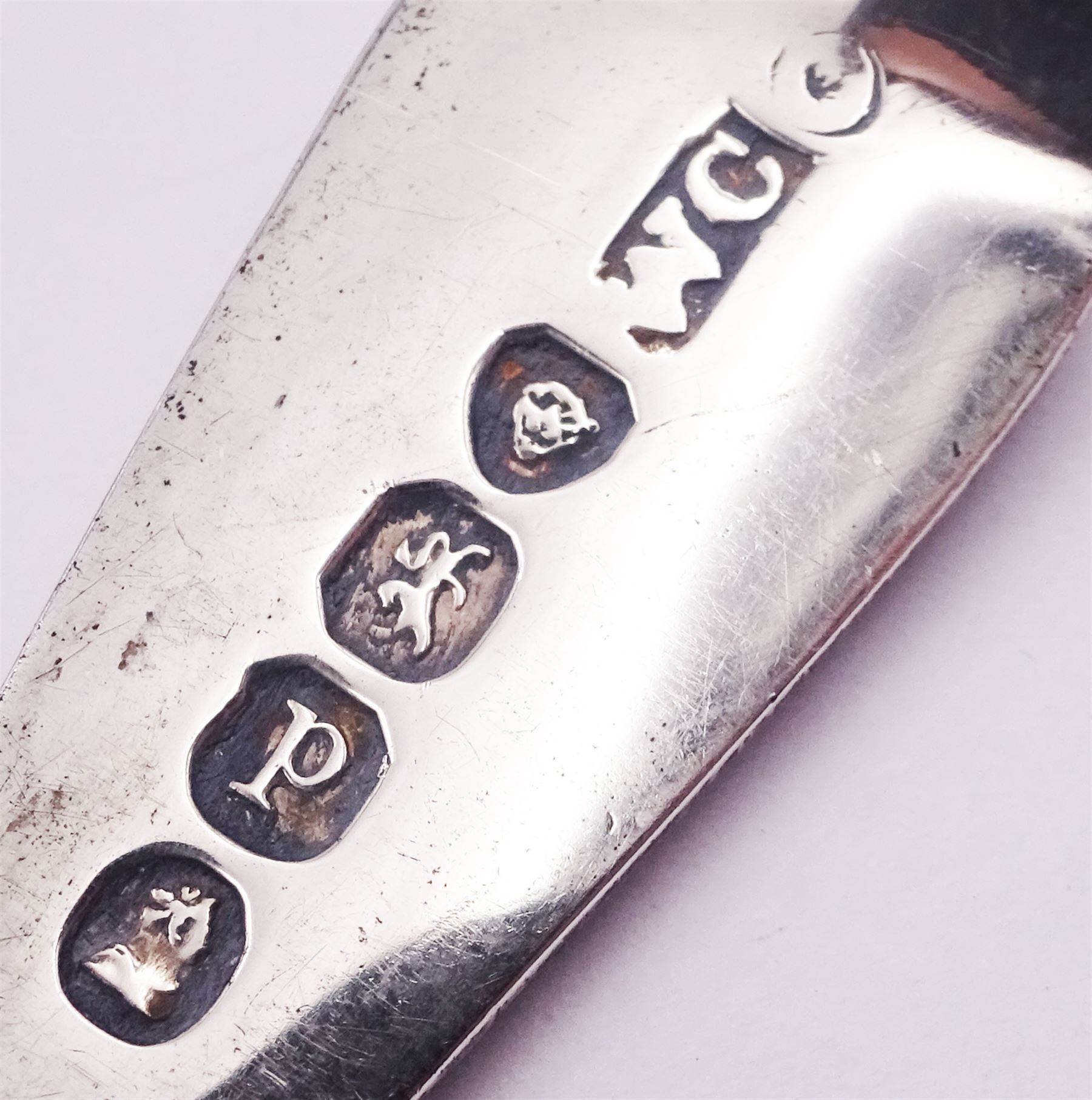 Set of twelve George III and later matched Celtic point pattern teaspoons, with bright cut engraved decoration, various hallmarks, to include a pair of William IV examples hallmarked James Beebe, London 1832, a further pair of William IV examples hallmarked William Chawner II, London 1830, approximate total weight 5.40 ozt (168.1 grams)