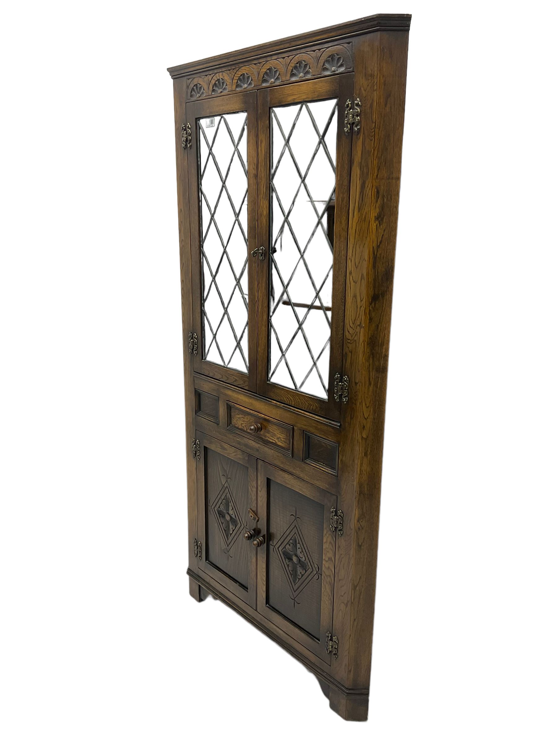 Jacobean design oak corner display carved frieze over