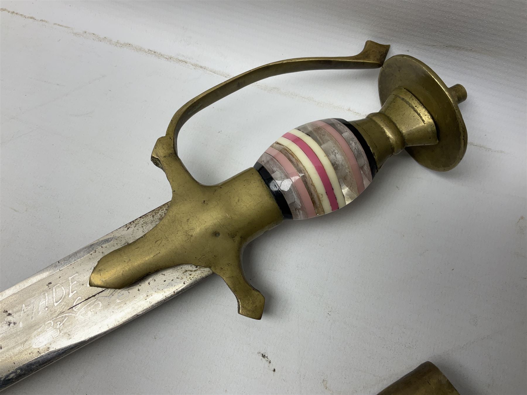 Early 20th century Indian ebonised sword stick, the 59.5cm blade with punched decoration and horn grip L94cm overall; and a reproduction Indian tulwar with scabbard (2)