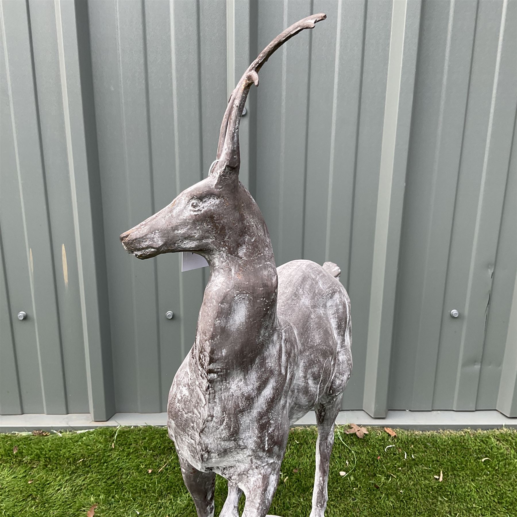 A pair of cast iron garden stag finials on ball bases - THIS LOT IS TO BE COLLECTED BY APPOINTMENT FROM DUGGLEBY STORAGE, GREAT HILL, EASTFIELD, SCARBOROUGH, YO11 3TX