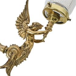 Pair of Victorian style wall sconces, each modelled as a caryatid supporting a single light fitting in one raised arm, with tapering and fluted clear glass shade, approximately H31cm D21cm