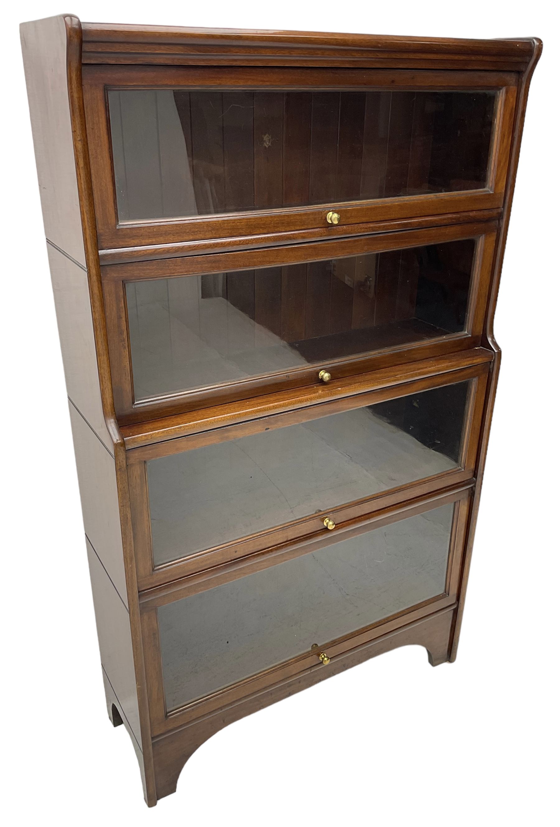 Kenric Efferson - early 20th century mahogany four-tier library bookcase, enclosed by four glazed up-and-over doors, on bracket feet