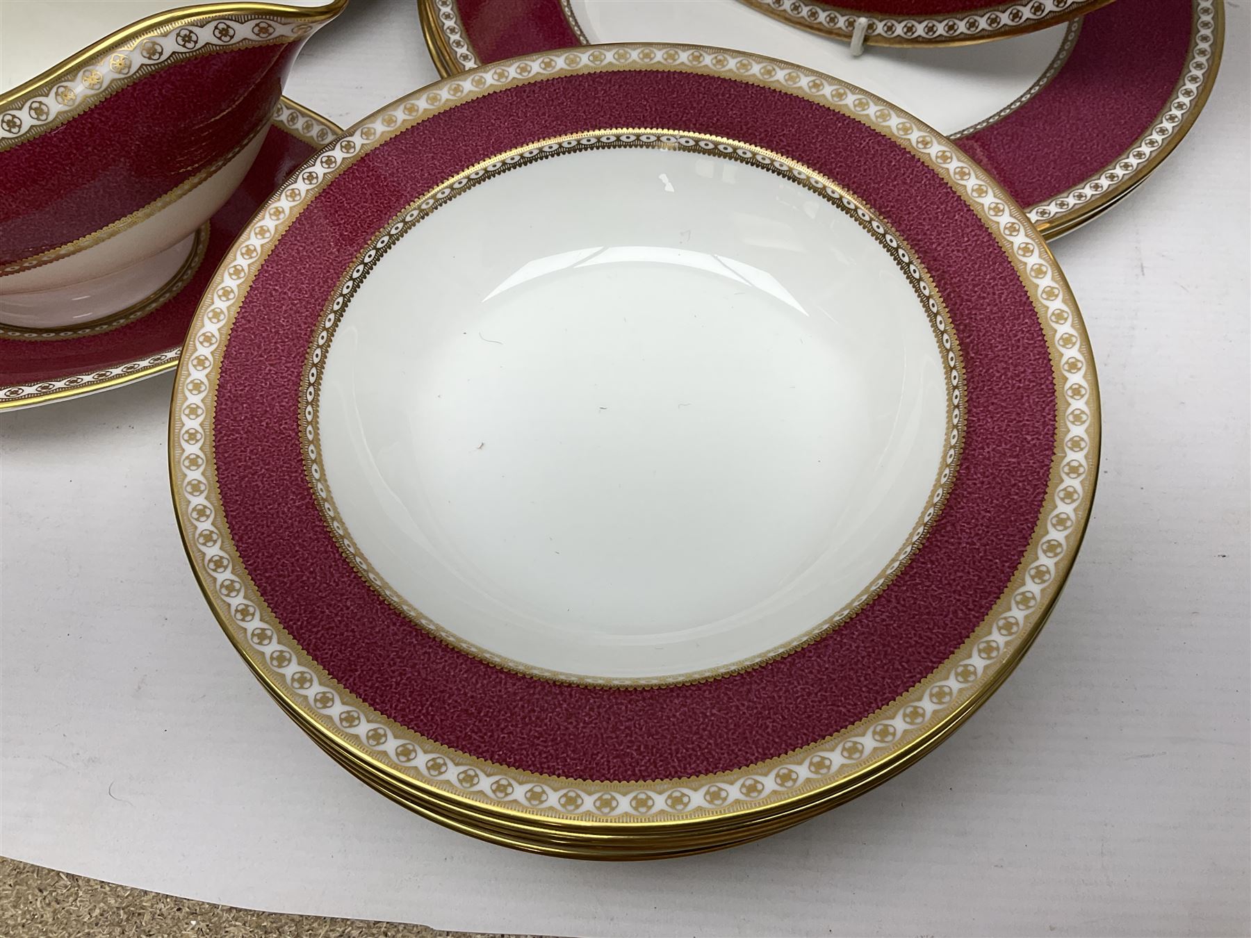 Wedgwood Ulander powder ruby pattern part dinner service, comprising six dinner plates, six side plates, six dessert plates, six soup bowls and sauce boat