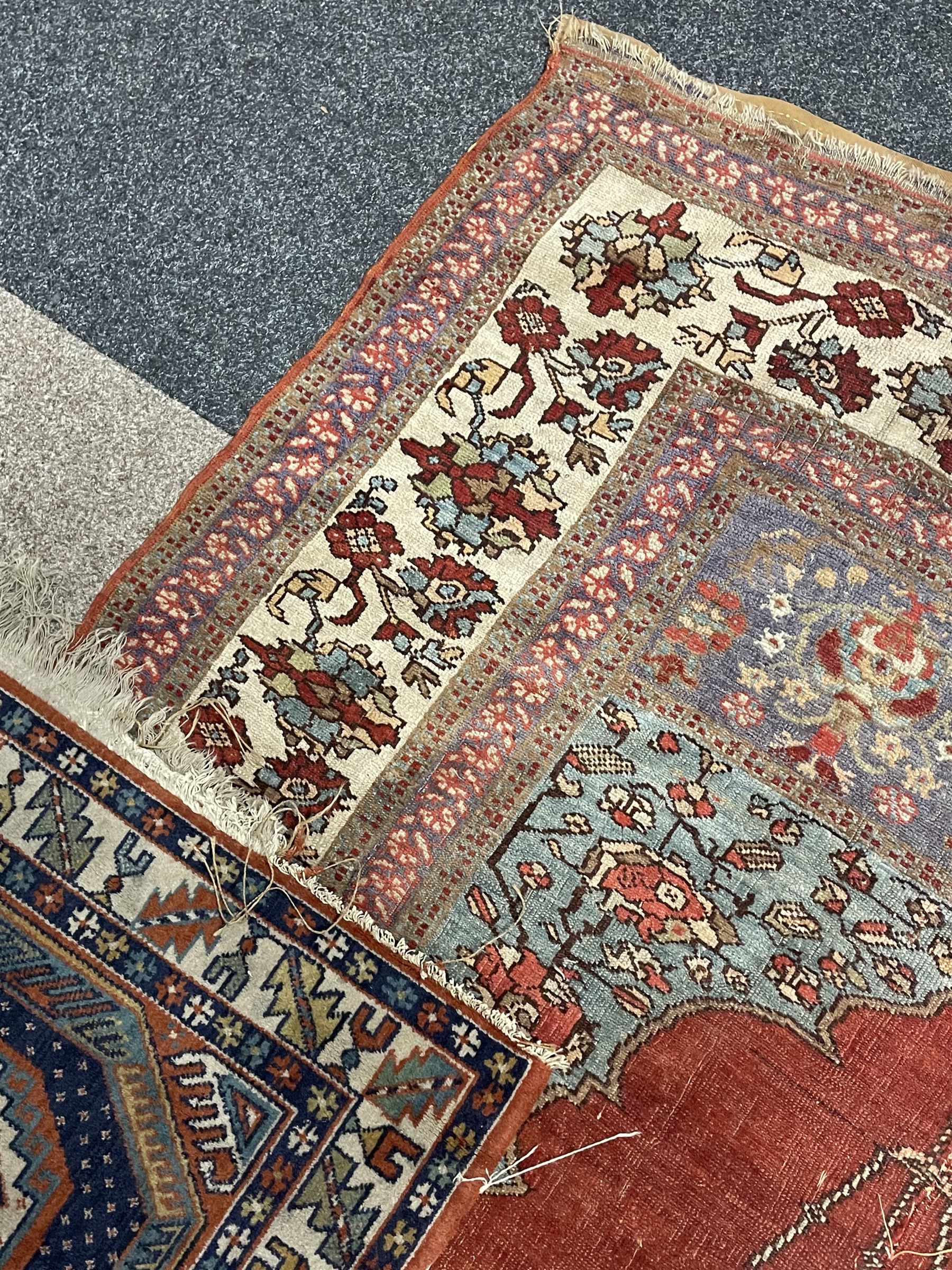 Persian red ground prayer rug, decorated with stylised flowers (201cm x 143cm), and a small Persian design triple medallion rug (142cm x 68cm)