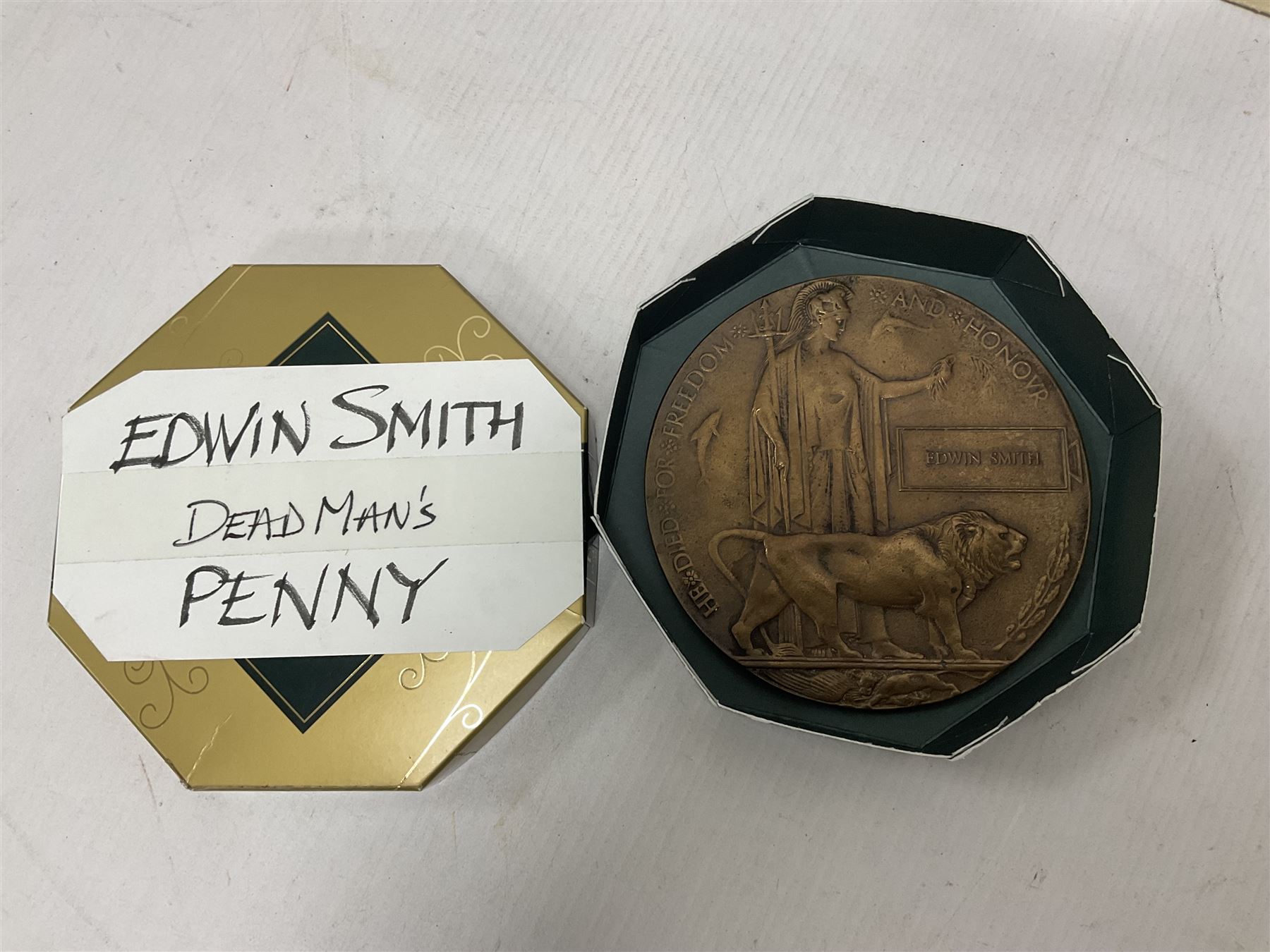 WWI bronze death plaque to Edwin Smith, together with two tankards presented to E.Smith and photographs of his family  