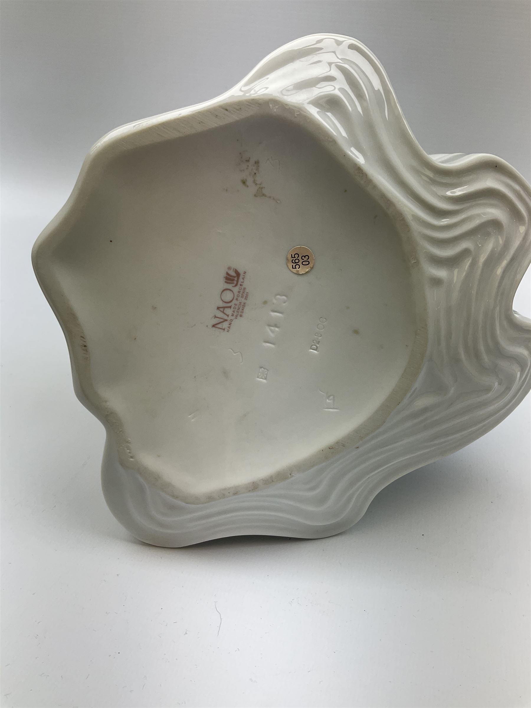 Collection of seven Lladro figures, including Seated ballerina with swan 6204, Childhood Dream 8129, Dancer 5050, reclining clown with ball alongside a selection of other figures. 