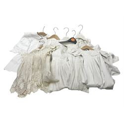 Seven lacework christening gowns