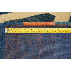 20th century Anatolian Turkish indigo ground rug with Art Deco inspired abstract design in tones of ivory, crimson and coral