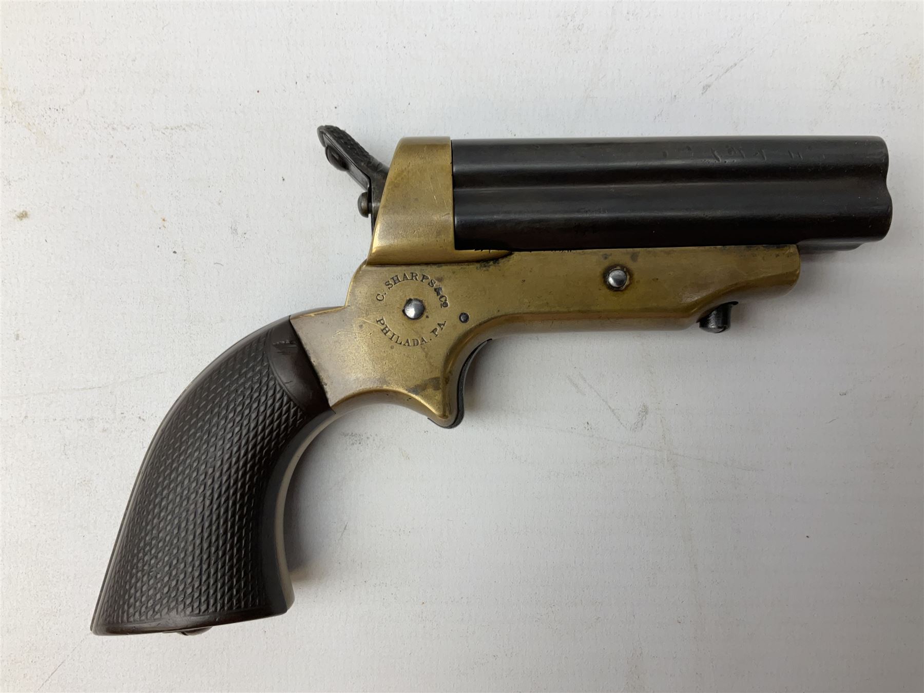 Mid-19th century Sharps' Patent Repeater four-barrelled Deringer pistol, dated 1859, approximately .30 calibre rim fire, brass bodied with rotating firing pin, serial no.8767, L16cm; in fitted rosewood box with label under lid, rack of ten deactivated cartridges, oil bottle and screwdriver and owner's name in brass cartouche to lid.