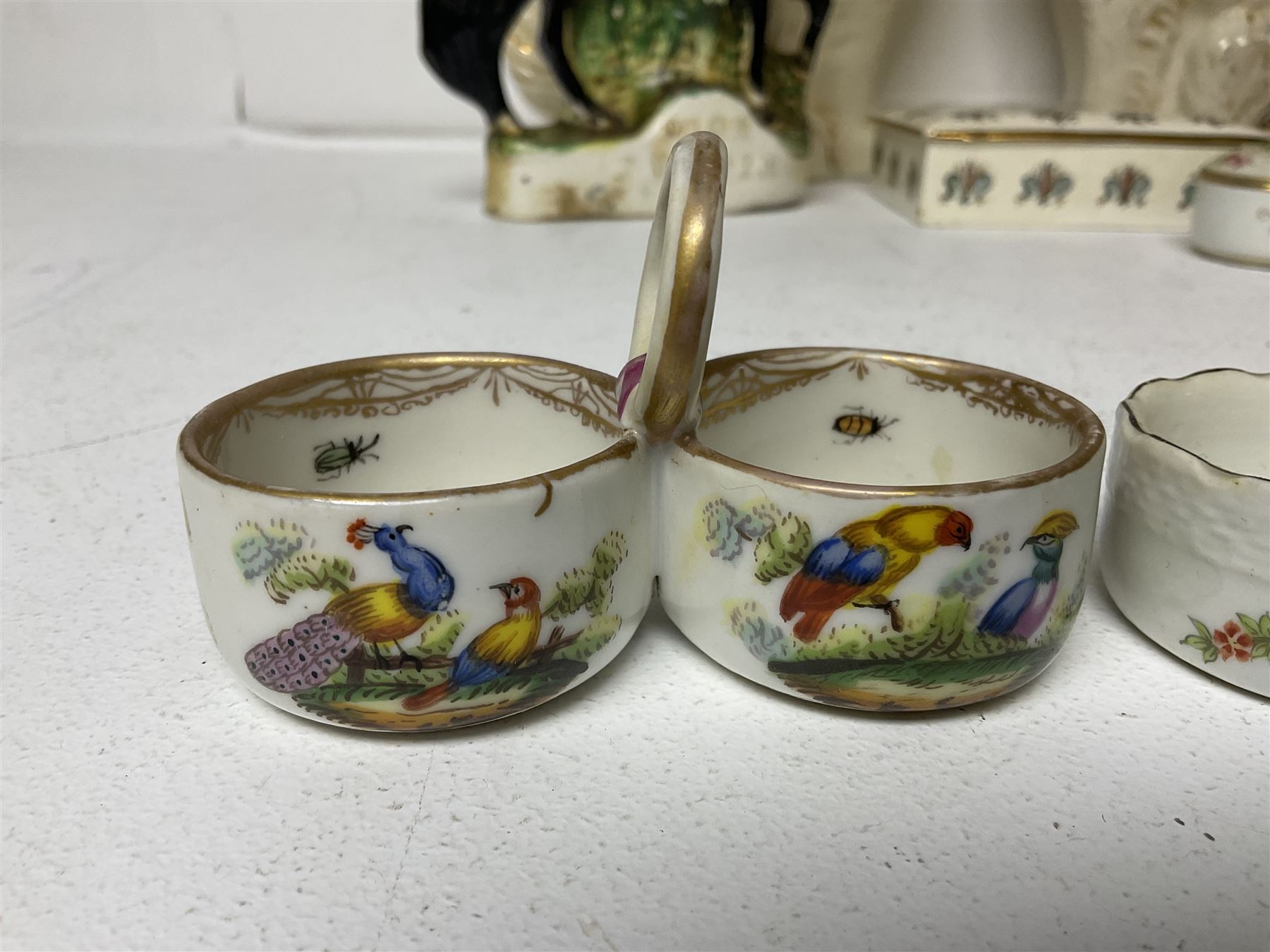 Staffordshire figure of the Duke of Wellington on a bay horse, H30cm in red uniform, together with a similar Staffordshire figure of Dick Turpin, pair of Staffordshire style dogs, H27cm, three Meissen style double salts and two trinket boxes 