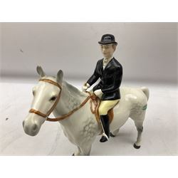 Beswick hunting group, comprising huntswoman on grey horse no. 1730, standing fox no. 1440, seated fox no. 1748 and twelve fox hounds, all with printed marks beneath
