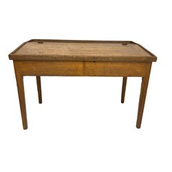 Late 19th century walnut school desk, sloped hinged lid, on square tapering supports 