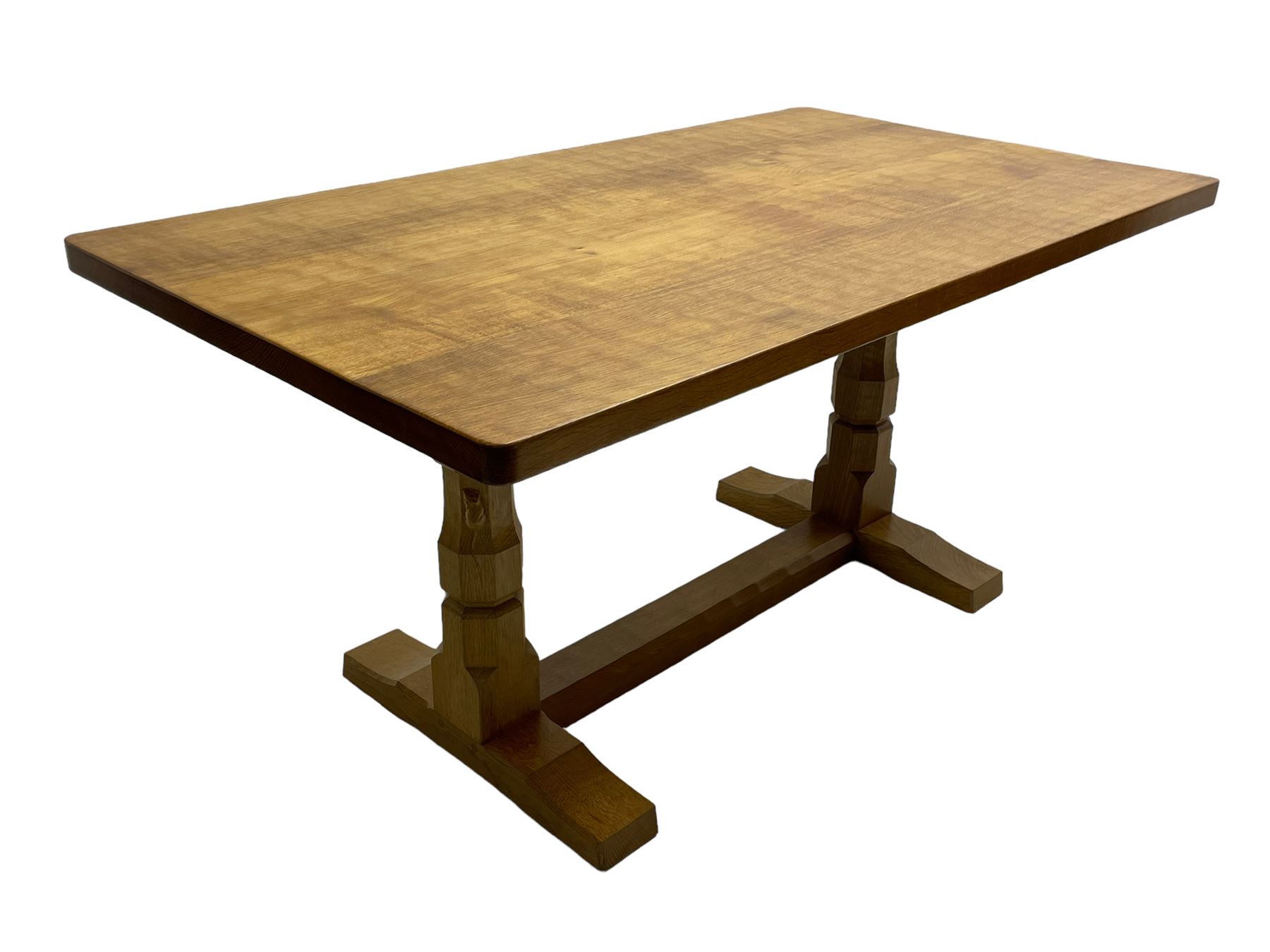 Mouseman - oak dining table, adzed rectangular top on twin octagonal pillar supports, sledge feet united by floor stretcher, by the workshop of Robert Thompson, Kilburn 