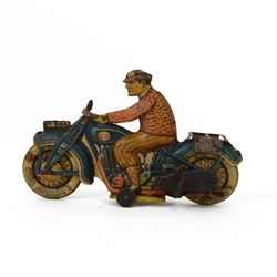 Tipp & Co tinplate clockwork motorcycle no. T686, the motorbike in dark blue with Dunlop cord wheels in cream, the civilian rider in orange clothing, H12.5cm ,W19cm