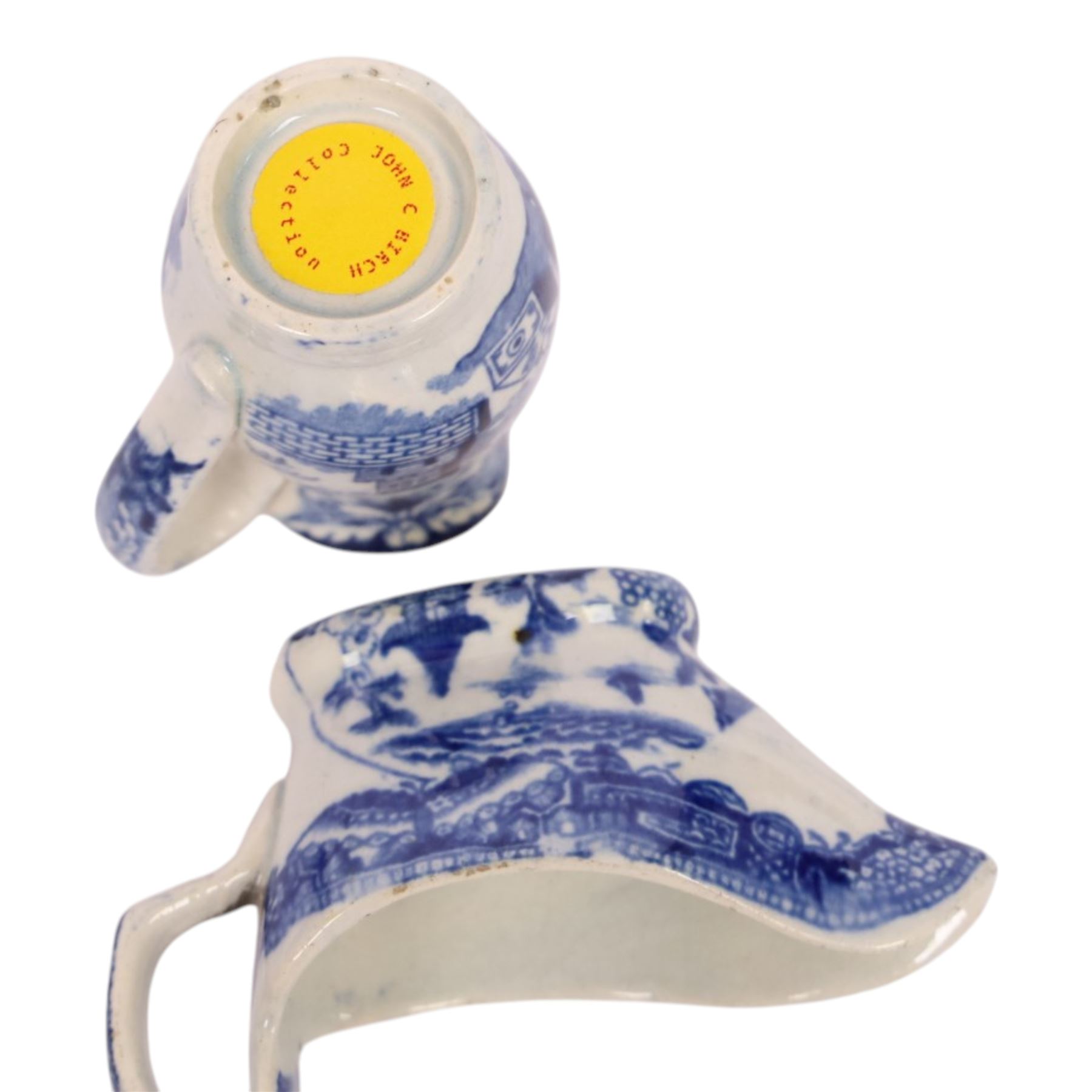 Group of 18th and 19th century ceramics, comprising 18th century pearlware tea caddy, if cylindrical form decorated with building and trees, H10.5cm, an 18th century blue and white pearlware saucer with similar decoration, D10.5cm, an 18th century creamware lozenge shaped boat, the interior painted with floral sprig, L12cm, and three pieces of 19th century blue and white transfer printed pottery, including a miniature jug decorated with the Playing Hoops pattern, H5.5cm, plus a Masons Bird and Flower pattern small octagonal basin, D10cm, (7)