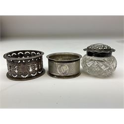 Two silver napkin rings, silver spoon with thistle top terminal, two silver handled butter knives, and small glass jar with silver cover, all hallmarked, approximate weighable silver 53.7 grams