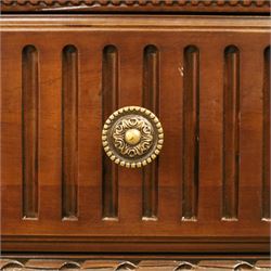 And So To Bed - French design ‘Eclectic’ double wardrobe in dark finish, arched moulded cornice with carved foliate band and turned finials, two mirrored doors enclosing a hanging rail, flanked by turned columns with foliate decoration, single fluted drawer below, on turned tapering feet