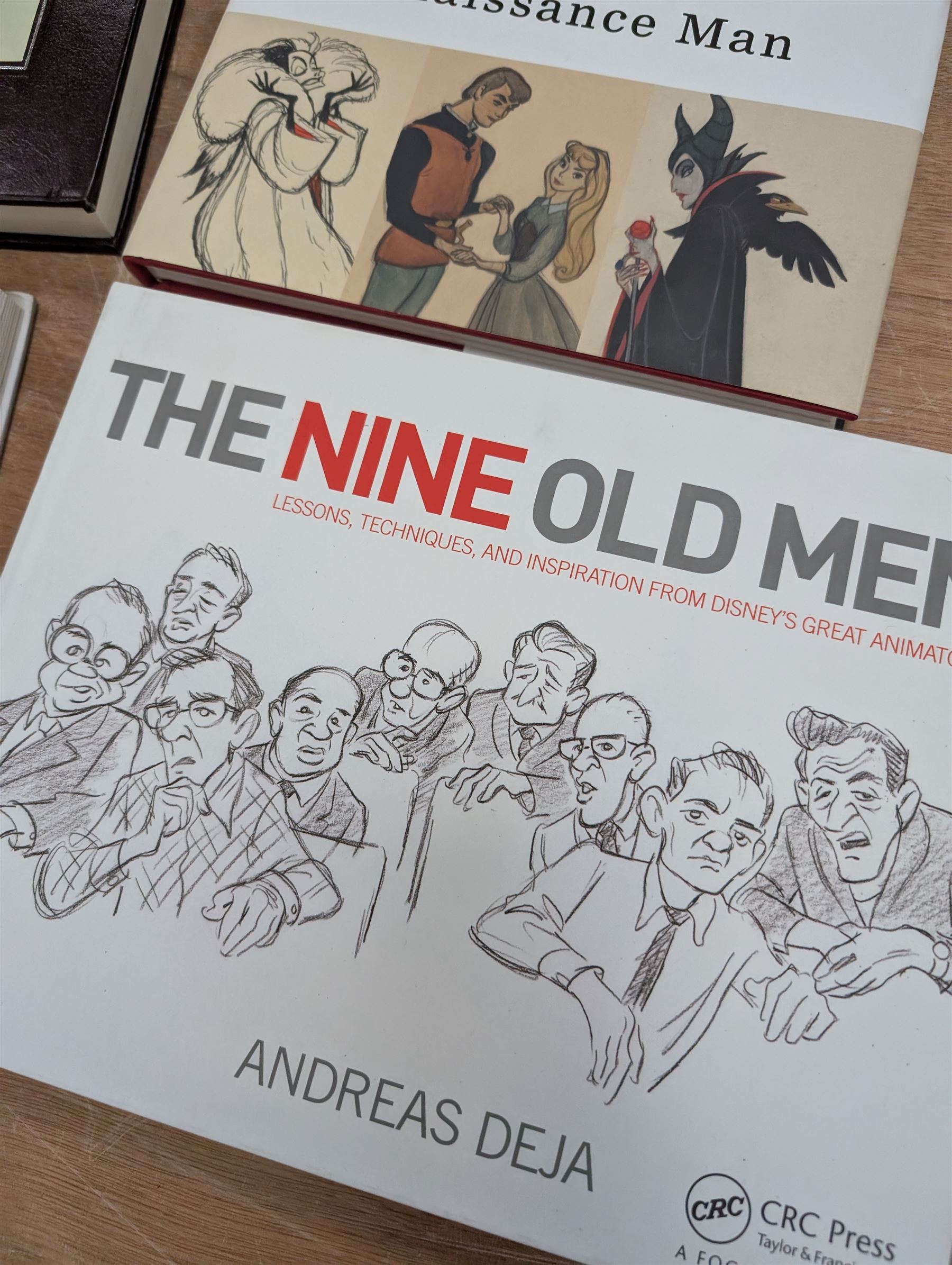 Collection of Disney animation and drawing books, including Walt Disney's Nine Old Men flipbooks, three Nine Old Men reference books, Marc Davis Walt Disney's Renaissance Man, A Disney Sketchbook and The Illusion of Life (7)