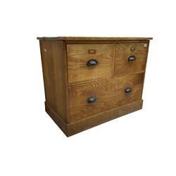 Early to mid-20th century oak chest, fitted with two short drawers over one long drawer, raised on plinth base