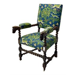 19th century Carolean design oak armchair, upholstered in a vibrant fabric depicting woodland and wildlife scenes, carved lion mask arm terminals, raised on barley twist supports united by H-stretcher